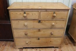 Pine chest of two short above three long drawers, 100cm by 115cm.