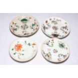 Four Chinese polychrome saucer dishes.