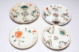 Four Chinese polychrome saucer dishes.