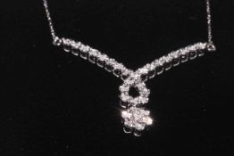 9 carat white gold diamond necklace.