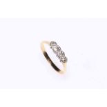 Four stone diamond ring set in 18 carat gold and platinum, size N.