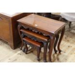 Nest of three Oriental hardwood tables (largest 56cm by 64cm).