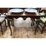 Late 19th/early 20th Century mahogany silver table on paw feet, 72cm by 92cm.