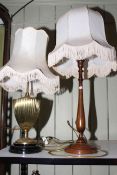 Two table lamps, one is brass column mounted.