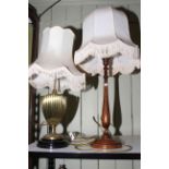 Two table lamps, one is brass column mounted.