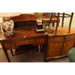 Mahogany fold top ladies writing desk and burr crossbanded two door bow front cabinet.