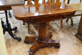 Victorian mahogany fold top card table raised on turned pedestal to inverted quadriform base, 73.