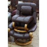 Himolla brown leather adjustable swivel chair and footstool.