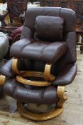 Himolla brown leather adjustable swivel chair and footstool.