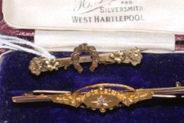 Edwardian 15 carat gold and diamond set bar brooch, boxed; and 9 carat gold brooch (2).