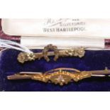 Edwardian 15 carat gold and diamond set bar brooch, boxed; and 9 carat gold brooch (2).