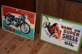 Two signs, BSA Rocket and Super Shell Oil.