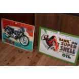 Two signs, BSA Rocket and Super Shell Oil.