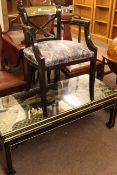 Oriental black lacquered and figure decorated rectangular coffee table, 44cm by 118cm,