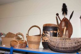 Wood and animal hide tribal shield, tribal drum and collection of wicker baskets.