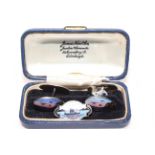 Pair silver and enamel cufflinks decorated with sunset coastal scenes, with similar brooch (2).