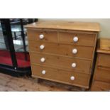 Pine chest of two short above three long drawers, 109cm by 104cm.