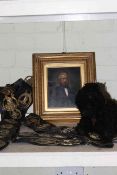 Leather martingales, gilt framed portrait and soft toy.