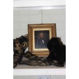 Leather martingales, gilt framed portrait and soft toy.