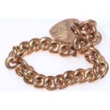 Chain link bracelet with padlock fastener in 9 carat gold.