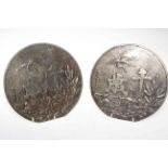 Two Japanese bronze circular plaques decorated with storks in foliage and character marks,