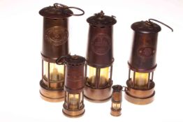 Collection of five miners lamps.