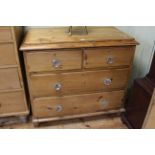 Pine chest of two short above two long drawers, 87cm by 96cm.