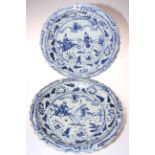 Pair of Chinese blue and white chargers decorated with figures on horseback, 40cm diameter.