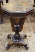 Victorian rosewood octagonal sewing table on inverted quadriform base, 71cm by 45cm.