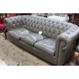 Taupe deep buttoned leather three seater Chesterfield settee, 200cm in length.