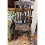 19th Century elm pierced splat back rocking chair.