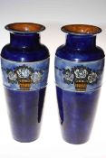 Pair Royal Doulton blue stoneware vases having band of roses in tubs, incised artists initials BN,