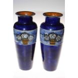 Pair Royal Doulton blue stoneware vases having band of roses in tubs, incised artists initials BN,