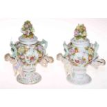 Pair Continental porcelain cherub and flower encrusted vases and covers, 18cm.