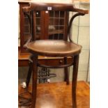 Bentwood elbow chair and two handled trunk.
