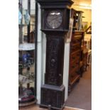 Antique carved oak longcase clock having circular dial, signed Stephen Simpson, Greta Bridge.