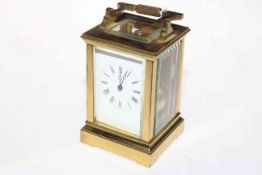 Gilt brass carriage clock with striking movement.