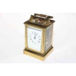 Gilt brass carriage clock with striking movement.