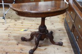 Victorian burr walnut fold top card table on turned and carved pedestal to four scrolled legs,