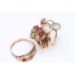 Collection of four gold rings including antique seed pearl and ruby.