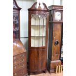 Mahogany bow front standing corner cabinet having glazed panel door above two cupboard doors, 200cm.