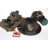 WWII Air Wardens helmet, two gas masks and ARP badges.