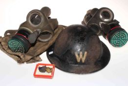 WWII Air Wardens helmet, two gas masks and ARP badges.