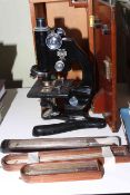 Beck, London 22245 cased microscope and three thermometers.