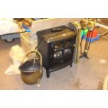 Dimplex electric fire, brass coal helmet, compendium set and spark guard.