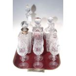Collection of five crystal decanters (one silver mounted) and six wine goblets.