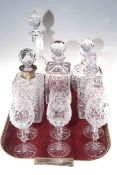 Collection of five crystal decanters (one silver mounted) and six wine goblets.