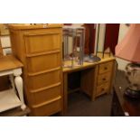 Light oak three drawer dressing table and slim five drawer chest.