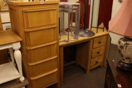 Light oak three drawer dressing table and slim five drawer chest.