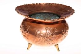 Benham & Froud, London copper jardiniere with embossed decoration and on three brass feet,